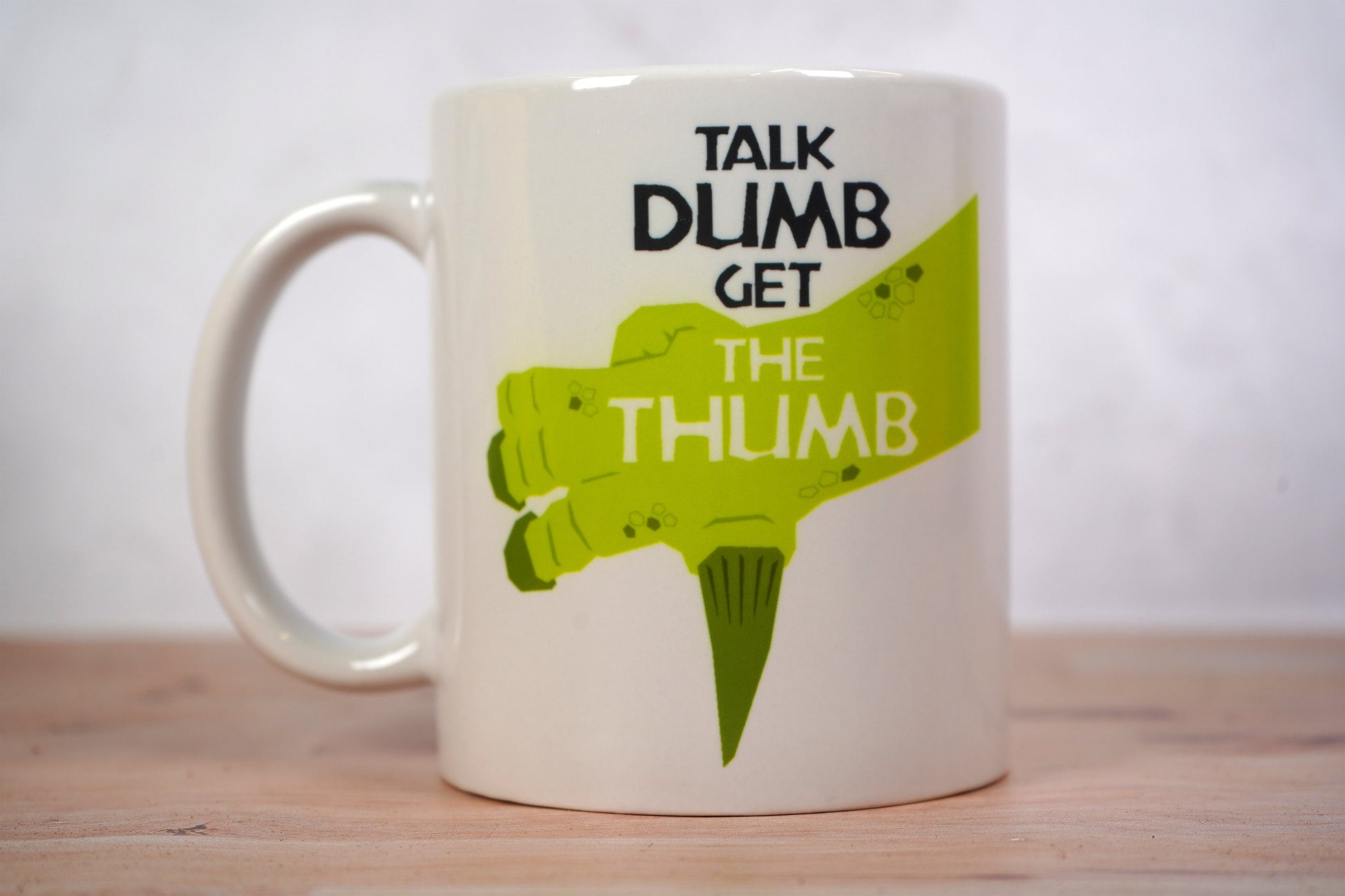 Talk Dumb Get the Thumb Iguanodon Coffee Mug