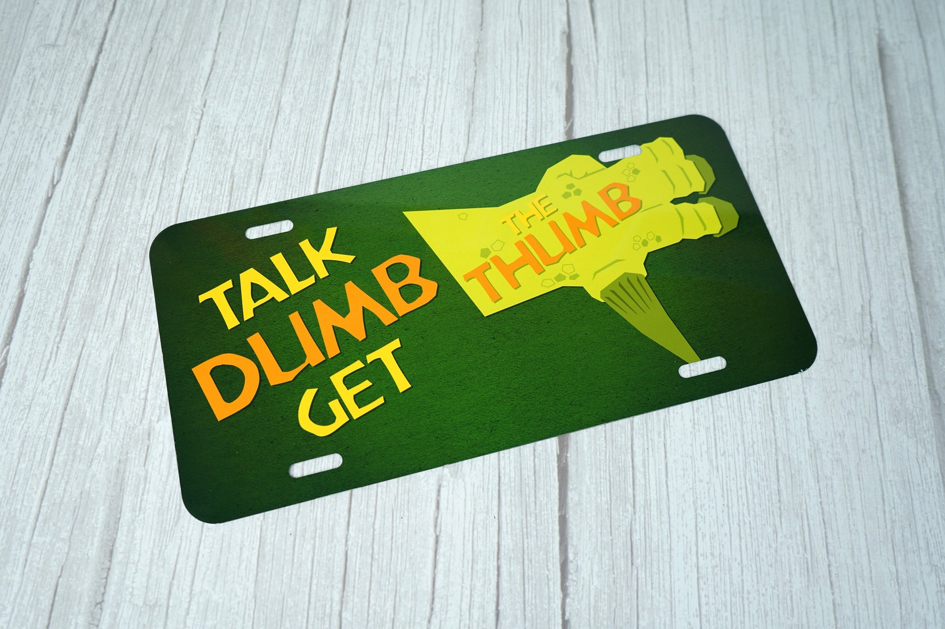 Talk Dumb Get the Thumb Novelty License Plate